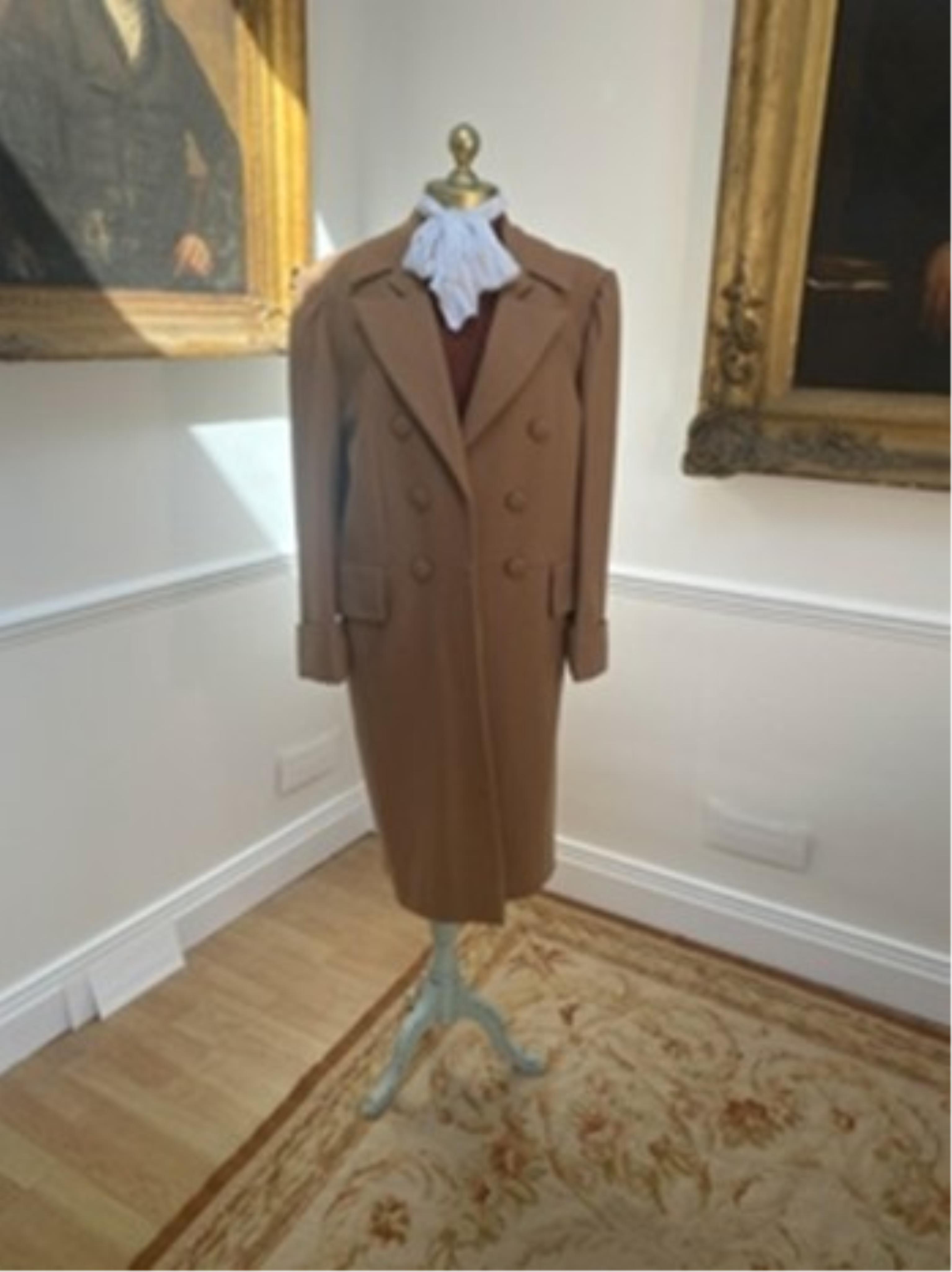 A camel men’s wool frock coat. Size Medium/Large. Condition - slight moth damage